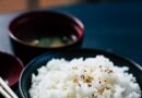 rice with sesame in black bowl