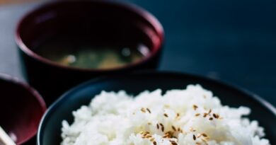 rice with sesame in black bowl